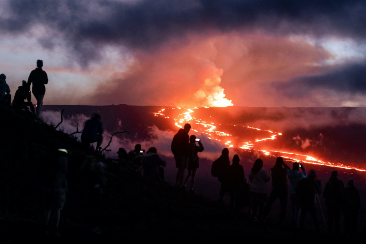People gather to observe the eruption of the Mauna Loa Volcano in Hawaii, US, on 1st December, 2022. 