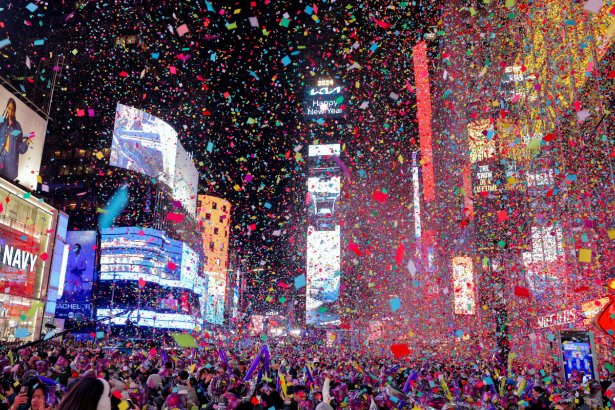 People watch confetti flying around after the clock strikes midnight during New Year celebrations at Times Square, in New York City, New York, US, on 1st January, 2024.