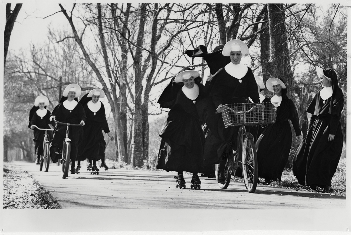 Juniorate members of the Marianites of the Holy Cross turn to bicycling and roller-skating for recreation during a break from spiritual and academic training in New Orleands in 1965. 