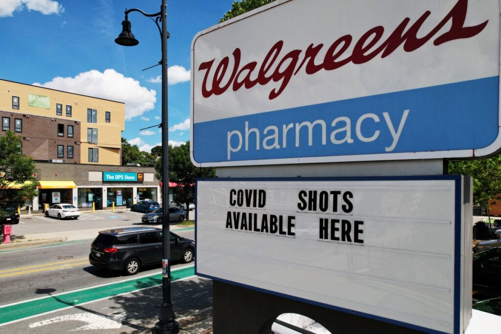 A sign advertises COVID-19 vaccine shots at a Walgreens Pharmacy in Somerville, Massachusetts, US, on 14th August, 2023