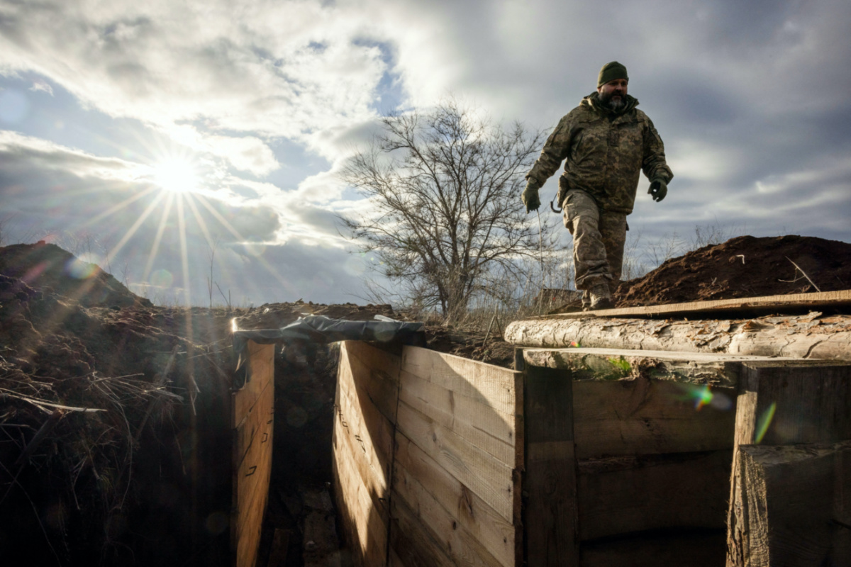 Ukrainian military engineer with the callsign Lynx inspects a freshly dug trench that his unit built as part of a system of new fortifications near the front lines outside Kupiansk, amid Russia’s attack on Ukraine, on 28th December, 2023