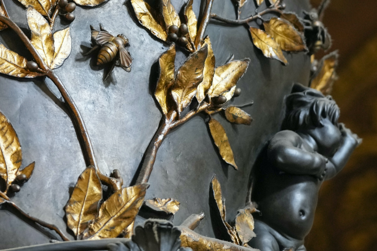 A detail of the leaves that adorn the columns of the 17th century, 95ft-tall bronze canopy by Giovan Lorenzo Bernini surmounting the papal Altar of the Confession in St. Peter's Basilica at the Vatican, on Wednesday, 10th January, 2024. 
